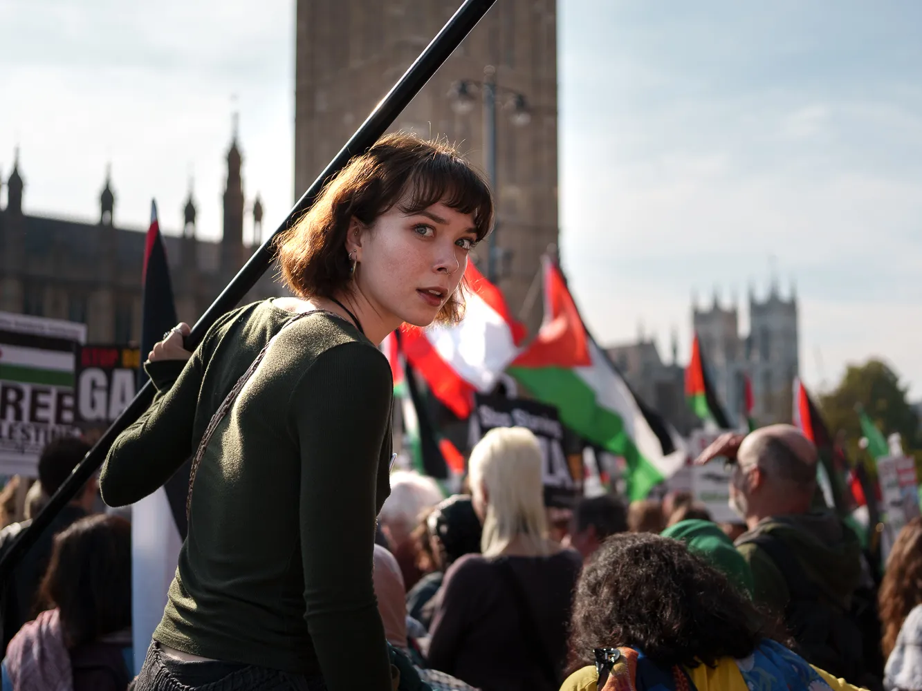 A demonstrator looking like Joan of Arc near the Houses of Parliament